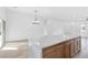 Kitchen island with marble countertop and light wood cabinets at 116 Crescent Bay St, Henderson, NV 89012