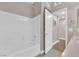 Clean bathroom with a tub, shower, and white tiling offering a fresh and bright space at 11870 Tevare Ln # 2086, Las Vegas, NV 89138