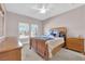 Bright bedroom featuring comfortable bed and matching wooden furniture at 11870 Tevare Ln # 2086, Las Vegas, NV 89138