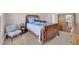 Well-lit bedroom featuring comfortable bed, chair, and closet at 11870 Tevare Ln # 2086, Las Vegas, NV 89138
