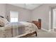 Relaxing bedroom with neutral tones, a large window, and classic furnishings at 11870 Tevare Ln # 2086, Las Vegas, NV 89138