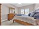 Cozy bedroom with comfortable bed, dresser, and bright natural light at 11870 Tevare Ln # 2086, Las Vegas, NV 89138