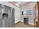 Bright kitchen featuring stainless steel refrigerator and a beverage cooler at 11870 Tevare Ln # 2086, Las Vegas, NV 89138