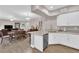 Open kitchen and dining area with stainless steel appliances and granite countertops at 11870 Tevare Ln # 2086, Las Vegas, NV 89138