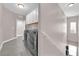 Spacious laundry room with modern appliances and ample storage, adjacent to staircase at 11870 Tevare Ln # 2086, Las Vegas, NV 89138