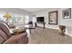 Comfortable living room showcasing wood floors, stylish decor, and plenty of natural light at 11870 Tevare Ln # 2086, Las Vegas, NV 89138
