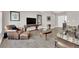 An inviting living room that is the heart of luxury and comfort, with neutral colors and natural light at 11870 Tevare Ln # 2086, Las Vegas, NV 89138