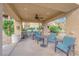 Outdoor seating area with ceiling fan, seating, and stainless steel BBQs at 11870 Tevare Ln # 2086, Las Vegas, NV 89138