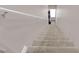 Carpeted staircase leading to lower level at 11870 Tevare Ln # 2086, Las Vegas, NV 89138
