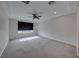 A carpeted bedroom with minimal furnishings showing a window and ceiling fan at 12397 Foxtail Run Ave, Las Vegas, NV 89138