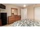 Well-lit bedroom with a dresser and queen-size bed at 1575 W Warm Springs Rd # 1113, Henderson, NV 89014