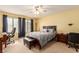 Spacious bedroom with a king-size bed, desk and chair at 1575 W Warm Springs Rd # 1113, Henderson, NV 89014