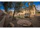 Landscaped backyard with artificial turf and stone pathway at 189 Carneros Ave, Henderson, NV 89002