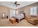 Relaxing main bedroom with a ceiling fan, shuttered windows, and carpeted flooring at 2425 Amatrice St, Henderson, NV 89044