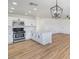 Modern kitchen with white shaker cabinets, quartz countertops and island at 2504 Clayton St, North Las Vegas, NV 89032