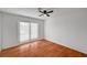 Well-lit bedroom featuring wood flooring and french doors at 2819 Calle Del Oro, Las Vegas, NV 89120