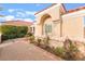 Tan stucco exterior with a tile roof and arched window at 2917 Golf Links Dr, Las Vegas, NV 89134