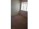 Simple bedroom with a window and carpeted floor at 346 Pinnacle Ct, Henderson, NV 89014
