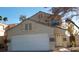 Two-story house with attached garage and landscaping at 346 Pinnacle Ct, Henderson, NV 89014