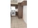 White appliances and dark brown cabinets in kitchen at 346 Pinnacle Ct, Henderson, NV 89014