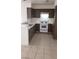 Kitchen features white appliances and dark brown cabinets at 346 Pinnacle Ct, Henderson, NV 89014