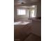 Spacious living room with kitchen view and sunlight at 346 Pinnacle Ct, Henderson, NV 89014