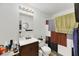 Functional bathroom with a wooden vanity and a shower with a patterned curtain at 3473 Monte Carlo Dr, Las Vegas, NV 89121