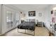 Bright bedroom with double doors to the outside and tiled floors at 3473 Monte Carlo Dr, Las Vegas, NV 89121