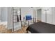 Cozy bedroom with a modern TV stand and a sleek decorative ladder at 3473 Monte Carlo Dr, Las Vegas, NV 89121