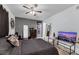 Relaxing bedroom featuring ceiling fan, a mounted TV, and contemporary decor at 3473 Monte Carlo Dr, Las Vegas, NV 89121