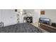 Cozy bedroom featuring tiled floors, a dark colored bed and modern amenities at 3473 Monte Carlo Dr, Las Vegas, NV 89121