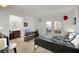 Bright bedroom with tile flooring, access to a bathroom, and outdoor patio at 3473 Monte Carlo Dr, Las Vegas, NV 89121