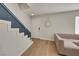Bright entryway features modern staircase, neutral color palette, and stylish light wood-look flooring at 3473 Monte Carlo Dr, Las Vegas, NV 89121