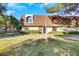 Inviting exterior featuring a well-maintained lawn and distinctive architectural details at 3473 Monte Carlo Dr, Las Vegas, NV 89121