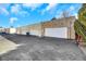 Exterior of garages connected to homes in a residential neighborhood at 3473 Monte Carlo Dr, Las Vegas, NV 89121