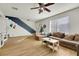 Open living space with stylish staircase, neutral tones, and natural light at 3473 Monte Carlo Dr, Las Vegas, NV 89121