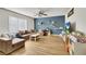 Spacious living room with sleek flooring, large window, and comfortable seating at 3473 Monte Carlo Dr, Las Vegas, NV 89121