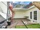Inviting patio space features artificial turf, a grill, spiral stairs, and a seating area with exterior access at 3473 Monte Carlo Dr, Las Vegas, NV 89121