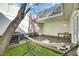 Inviting patio area with artificial grass, spiral staircase, outdoor seating, and barbecue grill at 3473 Monte Carlo Dr, Las Vegas, NV 89121