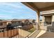 Spacious balcony area with a great view of neighborhood homes and blue sky at 365 Andy Wheeler Dr, Henderson, NV 89011