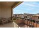Balcony offering neighborhood views with outdoor chairs and iron railing at 365 Andy Wheeler Dr, Henderson, NV 89011