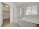 Bathroom with a walk-in shower and soaking tub near the walk-in closet at 365 Andy Wheeler Dr, Henderson, NV 89011