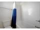 Close-up shot of the toilet and shower/tub combo, featuring a blue and white curtain at 365 Andy Wheeler Dr, Henderson, NV 89011