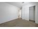 Bedroom featuring carpeted floor, white walls, closet and a door at 365 Andy Wheeler Dr, Henderson, NV 89011