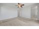 Bedroom with neutral carpet, ceiling fan, and ensuite bathroom at 365 Andy Wheeler Dr, Henderson, NV 89011
