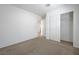 Bedroom featuring carpeted floor, white walls, closet and a door at 365 Andy Wheeler Dr, Henderson, NV 89011