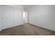 This bedroom offers neutral carpet and a double closet for additional storage at 365 Andy Wheeler Dr, Henderson, NV 89011