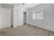 This bedroom offers neutral carpet, closet and a window to allow the natural light to illuminate the space at 365 Andy Wheeler Dr, Henderson, NV 89011