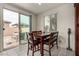 Dining area features a sliding glass door to patio and tile flooring at 365 Andy Wheeler Dr, Henderson, NV 89011