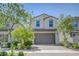 Charming two-story home showcasing a well-manicured front yard and neutral color palette at 365 Andy Wheeler Dr, Henderson, NV 89011